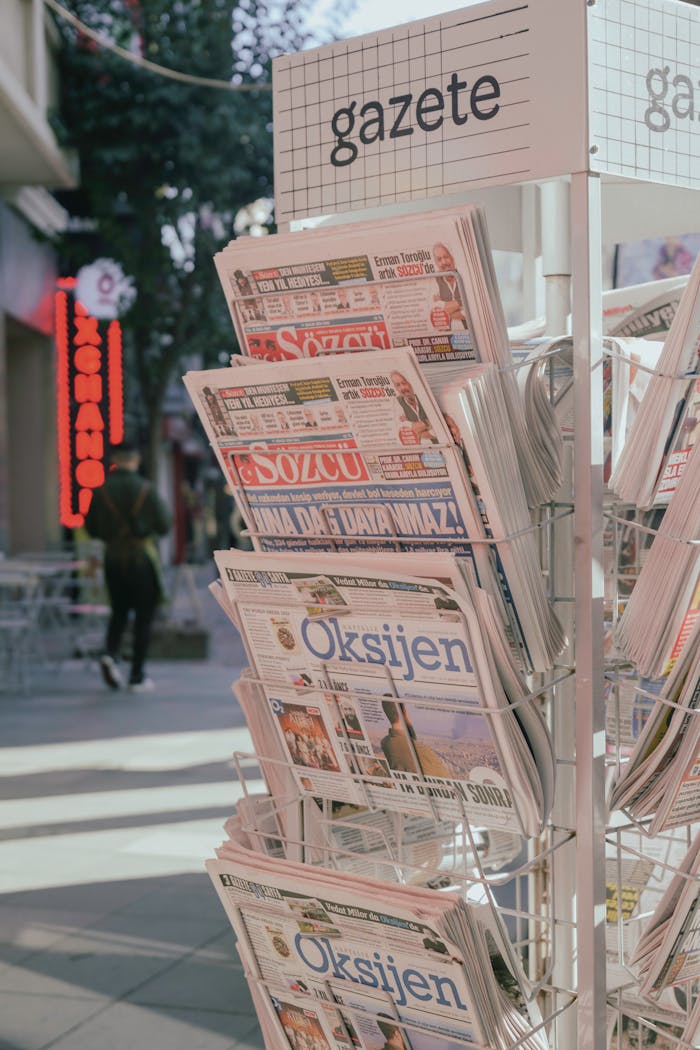 Newspapers on display in a street stand in Istanbul, capturing daily life and news media presence.